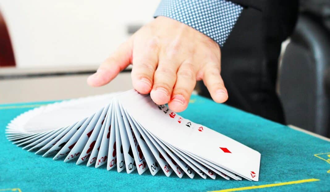 https://pixabay.com/photos/hands-playing-cards-magic-magician-859302/